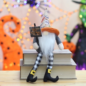 Detail of Halloween gnome with long legs and Happy Halloween sign on books