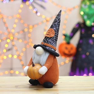 Halloween gnome plush with pumpkin and spider web hat on wooden table decor