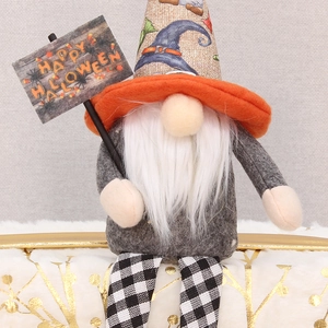 Detail of Halloween gnome featuring long plaid legs and a Happy Halloween sign