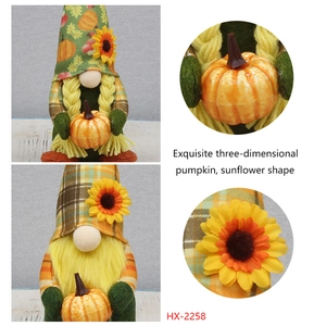 Close-up of harvest gnome plush with autumn pumpkin and sunflower decorative details