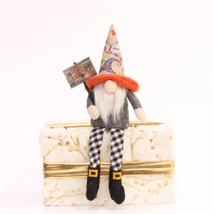 Halloween faceless gnome plush with RIP hat and Happy Halloween sign on a white fur box