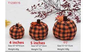 Three assorted sizes of orange and black plaid fabric pumpkins with maple leaf details