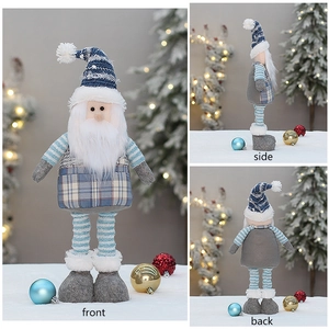 Front, side and back views of a blue fabric Santa gnome with retractable legs