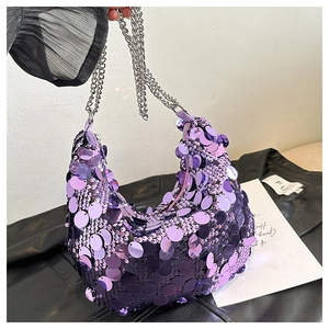 Detail of purple sequin crescent hobo bag with silver chain strap for party fashion
