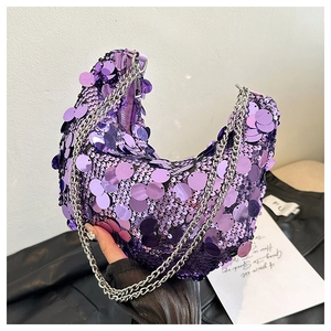 Detailed view of shimmering purple sequins and silver chain on a crescent moon bag