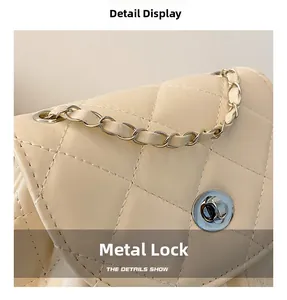 Detailed macro view of the silver metal turn-lock clasp and quilted leather stitching