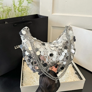 Silver sequin crescent shoulder bag with metallic chain straps for a trendy look