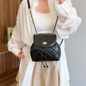 Chic black quilted backpack with diamond stitching and silver metal twist lock closure