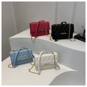 Detailed display of four quilted crossbody bags in rose, black, light blue, and white colors