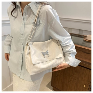 Chic cream PU messenger bag with silver butterfly buckle and chain strap on shoulder