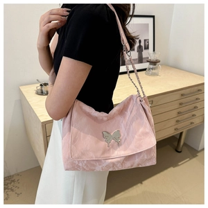 Pink pleated leather shoulder bag featuring a silver butterfly buckle and chain strap
