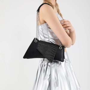 Fashionable black faux leather geometric crossbody bag with zebra print flap detail
