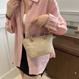 French style woven straw bucket bag with round handles and leather strap for women