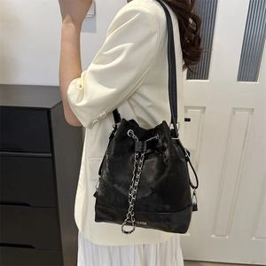 Fashionable black drawstring bucket bag with chain strap and large capacity for women