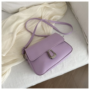 Detailed view of lavender PU leather crossbody bag with silver U-shaped magnetic clasp