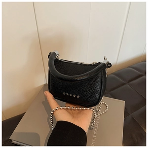 Mini black lychee leather saddle bag with star studs and silver ball chain strap