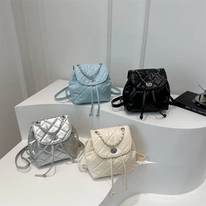 Chic quilted chain bucket backpack set in blue, black, silver, and cream colors