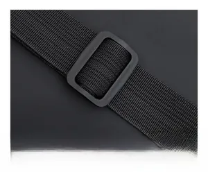 Detail of adjustable shoulder strap buckle on black nylon travel fitness bag