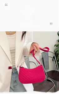 Hot pink felt shoulder bag featuring detailed V-shape quilting and gold chain strap