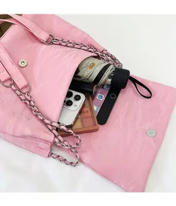 Pink butterfly shoulder bag detail showing spacious interior for phone and cosmetics