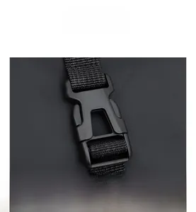 Detail view of durable black plastic buckle with sturdy nylon webbing strap