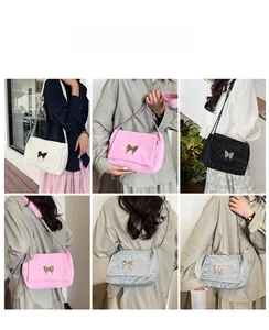 Chic shoulder bag with gold butterfly clasp shown in multiple fashion styling views