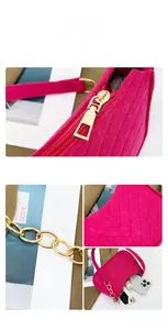 Detail view of fuchsia felt hobo bag with V-shaped quilting and gold chain strap