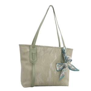 Light green tote bag with marble texture and decorative silk scarf on white background