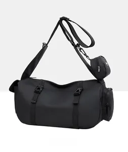Detail view of black travel gym bag showing waterproof fabric and adjustable shoulder strap