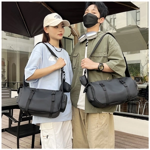 Detail of waterproof nylon fitness bag with double buckle closure and side pouch
