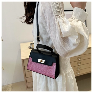 Detail of pink sequin crossbody bag on model wearing white textured dress