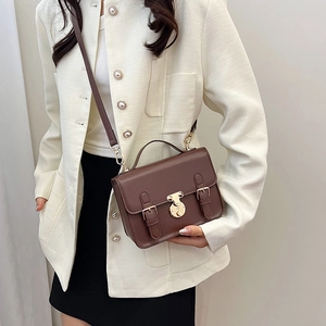 Brown vintage messenger crossbody bag with golden lock and adjustable strap