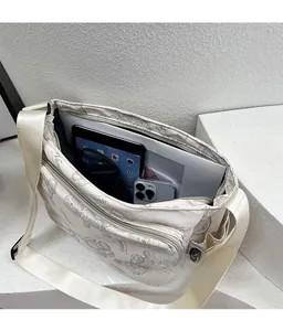 Spacious interior of printed nylon tote bag showing tablet and phone storage capacity
