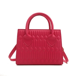Magenta quilted crossbody bag with diamond stitching and detachable shoulder strap