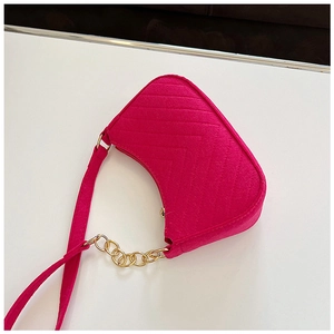 Detailed top view of fuchsia chevron quilted felt shoulder bag with gold chain strap