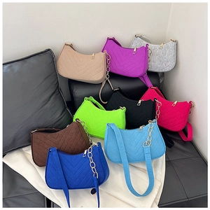 Multi-color collection of felt shoulder bags featuring V-shaped quilting and gold chains