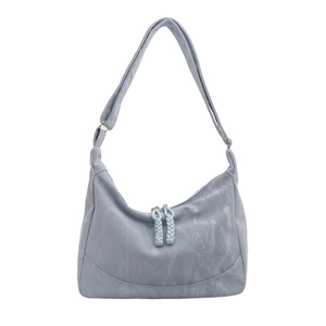 Light blue pleated hobo bag with a half-moon silhouette and braided zipper detail