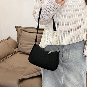 Chic black quilted felt shoulder bag with gold chain and V-shaped stitching detail