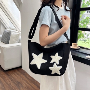 Sac fourre-tout minimaliste en toile noire avec étoiles en peluche blanches pour femme