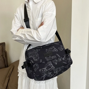 Large capacity black messenger bag with white bear prints and wide adjustable shoulder strap