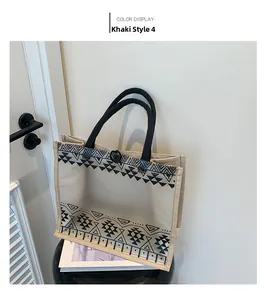 Detail of khaki linen tote bag with geometric black line print and clear PVC overlay