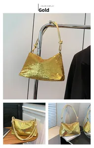 Detail of gold sequin underarm bag with unique knotted handle and reflective finish