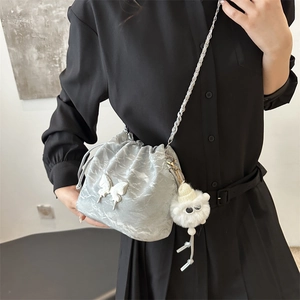 Silver metallic drawstring bucket bag with butterfly detail and chain strap for women