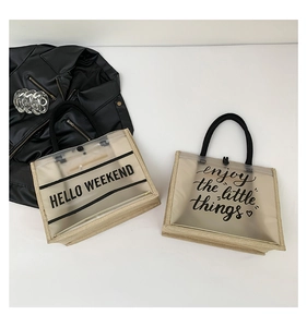 Macro shot of stylish linen PVC tote bags featuring Hello Weekend and Enjoy printed text