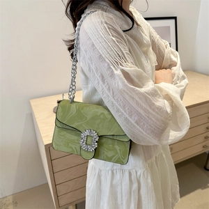 Chic light green crossbody bag with marble texture, rhinestone buckle and silver chain strap