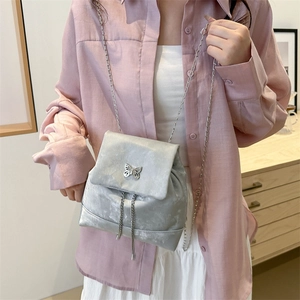 Silver butterfly chain mini backpack with metallic finish and stylish metal strap
