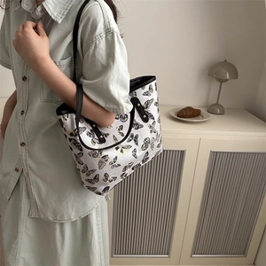 Women's large jacquard butterfly tote bag with black leather handles for summer fashion