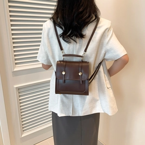 Vintage dark brown PU leather backpack for women with flap closure and adjustable straps