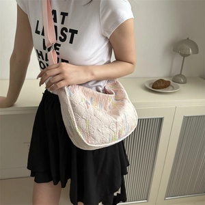 Pink quilted nylon crossbody bag with colorful bead embroidery and wide strap