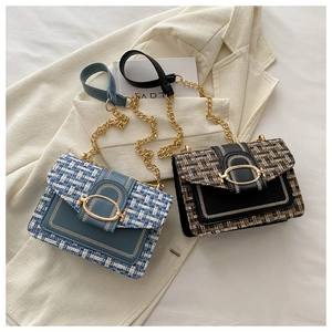 Close-up of tweed crossbody bags with gold horsebit buckles and metal chain straps